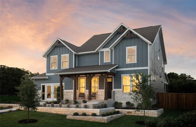 225 Hazy Hills Loop, Dripping Springs, TX 78620 - craftsman-style home featuring board and batten siding, stone siding, a porch, and a shingled roof