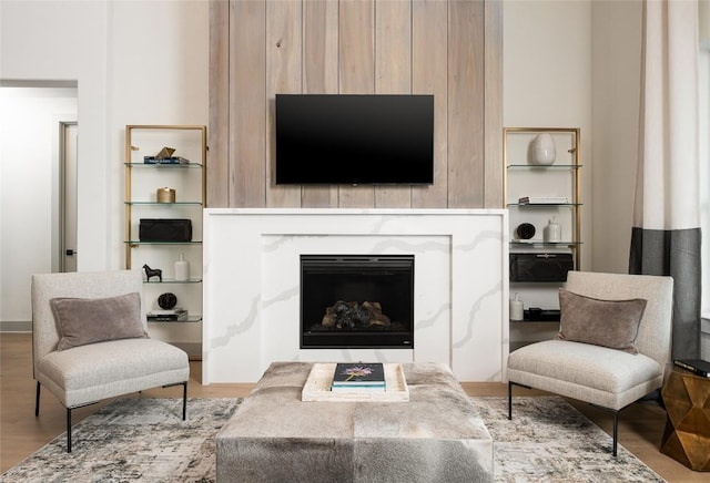 225 Hazy Hills Loop, Dripping Springs, TX 78620 - living area with a fireplace and wood finished floors