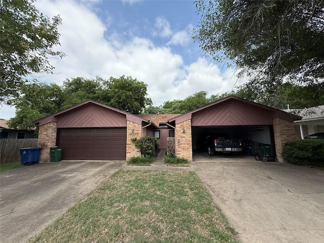 10502 Golden Meadow Dr, Austin, TX 78758 - view of front of house featuring a garage, brick siding, and driveway
