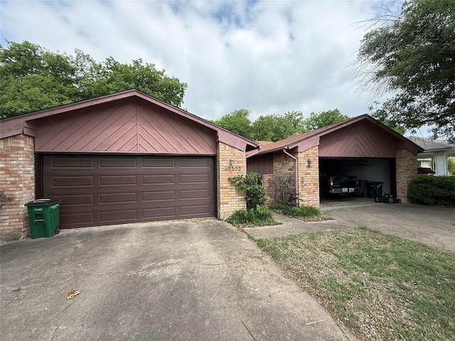 10502 Golden Meadow Dr, Austin, TX 78758 - view of front of property with driveway, a garage, and brick siding