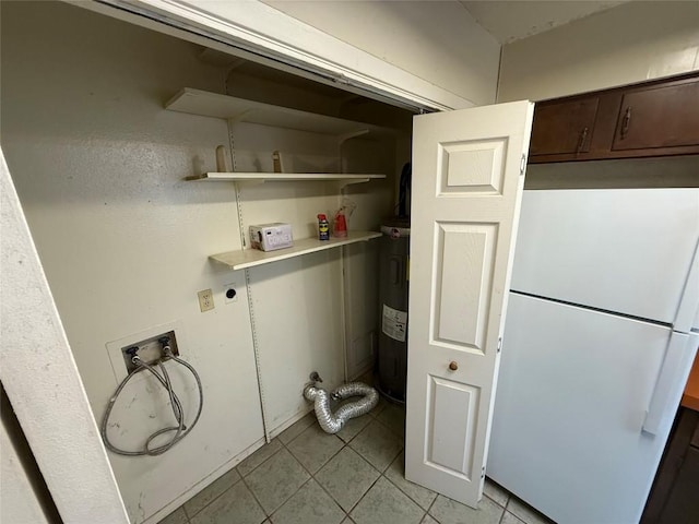 10502 Golden Meadow Dr, Austin, TX 78758 - washroom featuring washer hookup, electric dryer hookup, light tile patterned flooring, and electric water heater