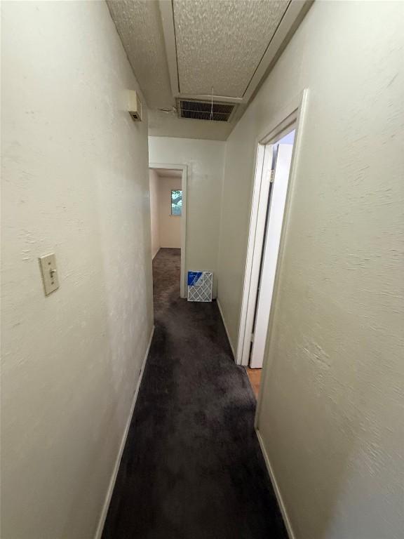 10502 Golden Meadow Dr, Austin, TX 78758 - hallway with attic access and carpet