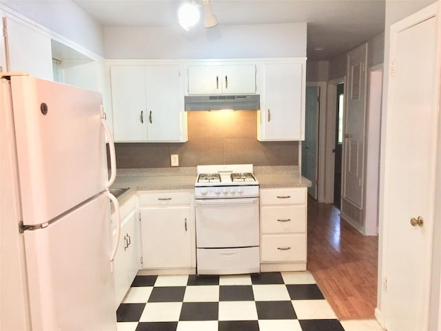 2403 Sherwood Ln, Austin, TX 78704 - kitchen with white appliances, under cabinet range hood, light flooring, and light countertops