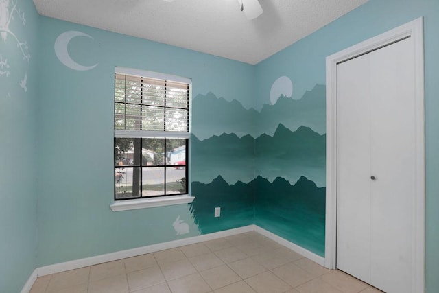 5808 Spring Meadow Rd, Austin, TX 78744 - empty room featuring a textured ceiling, baseboards, and ceiling fan
