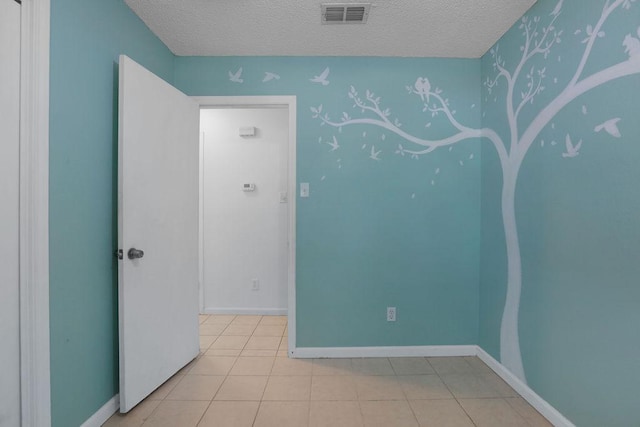 5808 Spring Meadow Rd, Austin, TX 78744 - tiled empty room with a textured ceiling, baseboards, and wallpapered walls