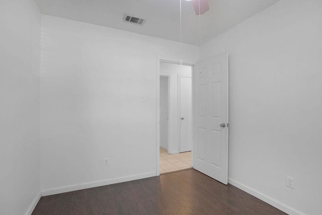 5808 Spring Meadow Rd, Austin, TX 78744 - empty room featuring baseboards, a ceiling fan, and wood finished floors