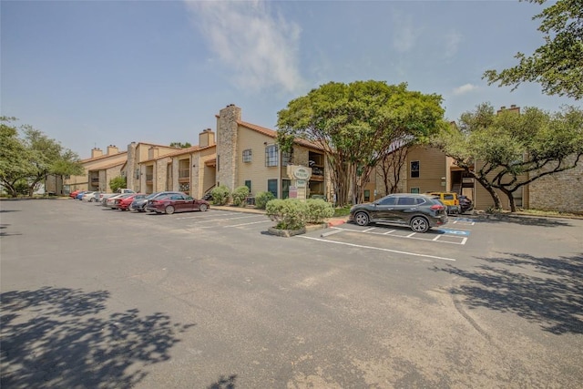 8600 Fathom Cir Unit 1303, Austin, TX 78750 - uncovered parking lot with a residential view