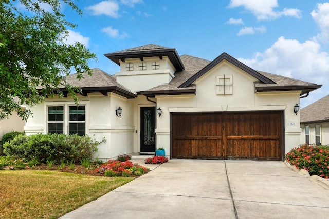 3324 Venezia Vw, Leander, TX 78641 - view of front of house with stucco siding, driveway, an attached garage, a shingled roof, and a front lawn