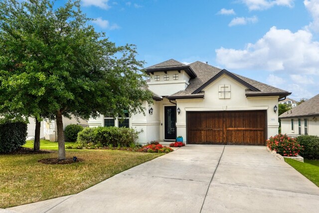 3324 Venezia Vw, Leander, TX 78641 - view of front of property with stucco siding, a front lawn, concrete driveway, and an attached garage