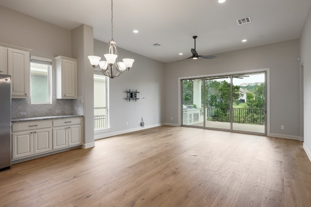 3324 Venezia Vw, Leander, TX 78641 - kitchen featuring a ceiling fan, freestanding refrigerator, plenty of natural light, backsplash, and recessed lighting