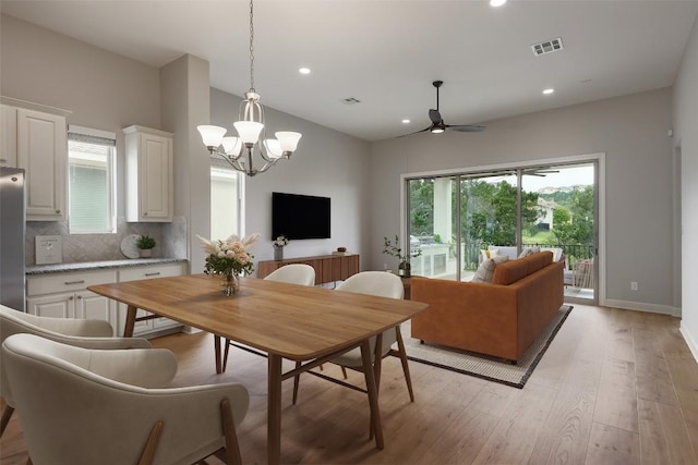 3324 Venezia Vw, Leander, TX 78641 - dining area with a ceiling fan, light wood-style floors, recessed lighting, and a chandelier