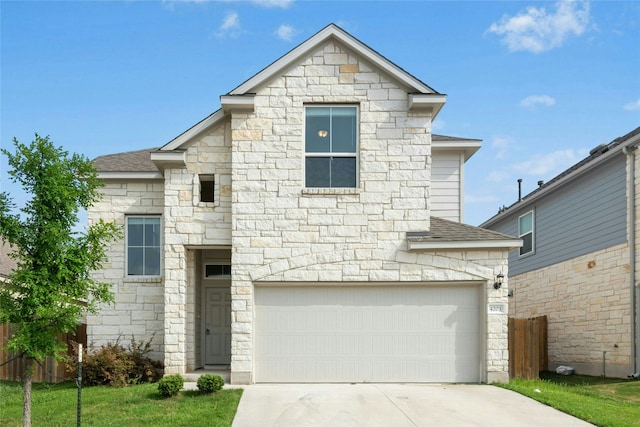 4203 Birdwatch Loop Unit 14, Pflugerville, TX 78660 - view of front facade with stone siding, concrete driveway, an attached garage, and a shingled roof