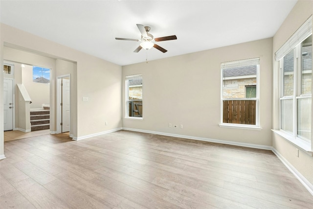 4203 Birdwatch Loop Unit 14, Pflugerville, TX 78660 - spare room featuring stairs, light wood-style flooring, and ceiling fan