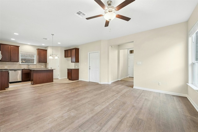 4203 Birdwatch Loop Unit 14, Pflugerville, TX 78660 - unfurnished living room with a ceiling fan, light wood-style floors, healthy amount of natural light, and recessed lighting