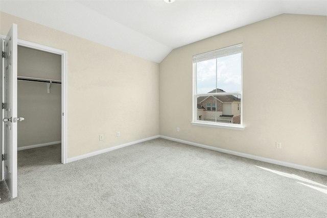 4203 Birdwatch Loop Unit 14, Pflugerville, TX 78660 - unfurnished bedroom featuring vaulted ceiling, carpet floors, a spacious closet, and a closet