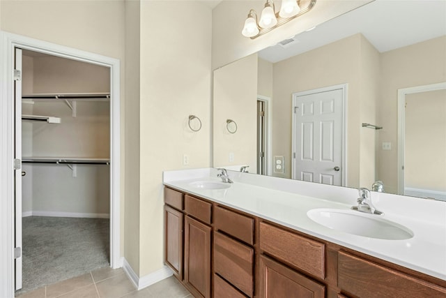 4203 Birdwatch Loop Unit 14, Pflugerville, TX 78660 - bathroom with tile patterned floors, double vanity, and a spacious closet