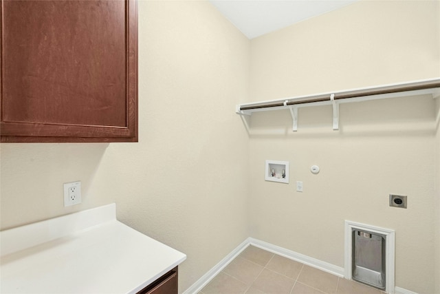 4203 Birdwatch Loop Unit 14, Pflugerville, TX 78660 - laundry room with electric dryer hookup, hookup for a washing machine, cabinet space, gas dryer hookup, and light tile patterned floors