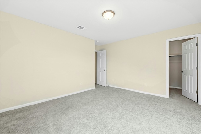 4203 Birdwatch Loop Unit 14, Pflugerville, TX 78660 - unfurnished bedroom featuring carpet, a walk in closet, and a closet