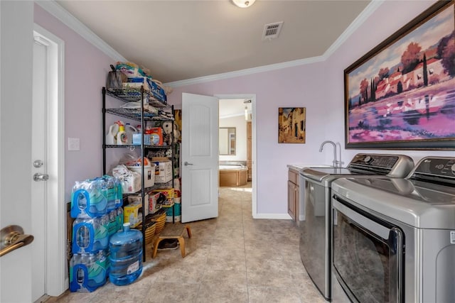 7500 Muleshoe Bend Trl, Marble Falls, TX 78654 - washroom with washer and clothes dryer, ornamental molding, baseboards, and cabinet space