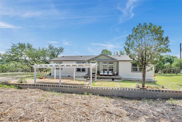 7500 Muleshoe Bend Trl, Marble Falls, TX 78654 - rear view of house with a pergola, a lawn, and a deck