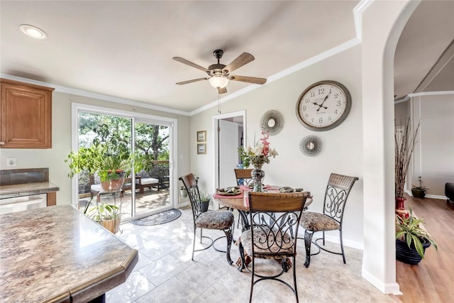 7500 Muleshoe Bend Trl, Marble Falls, TX 78654 - dining area with ornamental molding, a ceiling fan, arched walkways, and baseboards