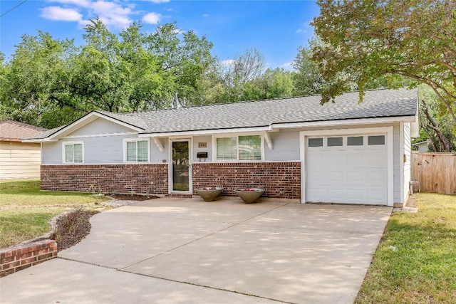 1505 Wheless Ln, Austin, TX 78723 - ranch-style house featuring brick siding, a garage, concrete driveway, and a shingled roof