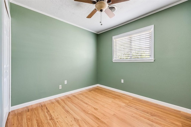 1505 Wheless Ln, Austin, TX 78723 - unfurnished room featuring ceiling fan, crown molding, and light wood-style floors