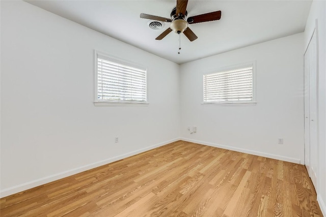 1505 Wheless Ln, Austin, TX 78723 - empty room with healthy amount of natural light, light wood-style flooring, and a ceiling fan