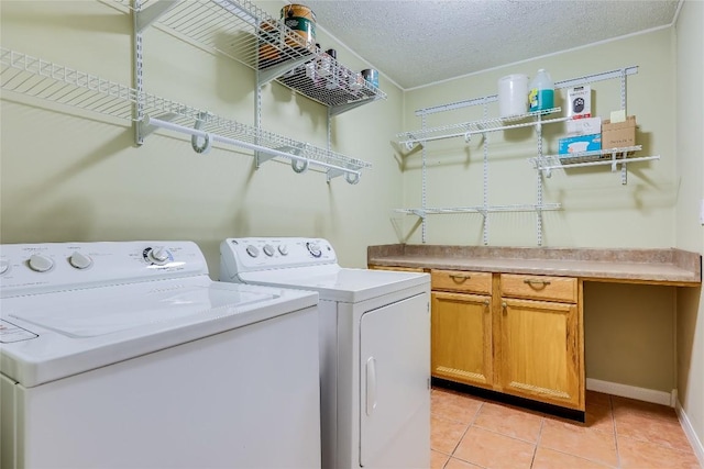 1505 Wheless Ln, Austin, TX 78723 - washroom with washer and clothes dryer, light tile patterned floors, and a textured ceiling