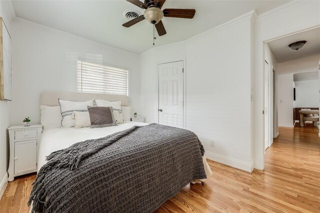 1505 Wheless Ln, Austin, TX 78723 - bedroom with light wood finished floors and a ceiling fan