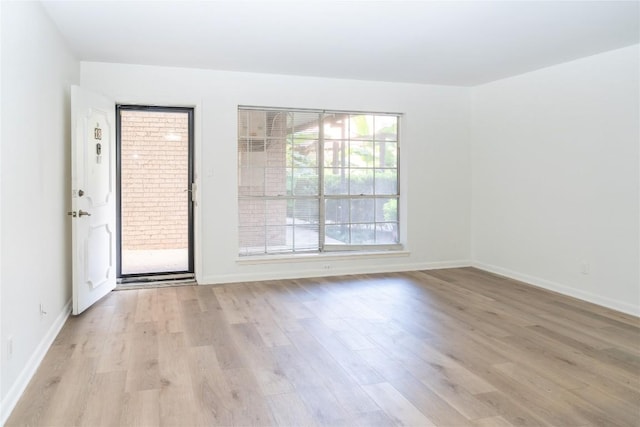 2425 Ashdale Dr Unit 18, Austin, TX 78757 - spare room with light wood-style floors and baseboards
