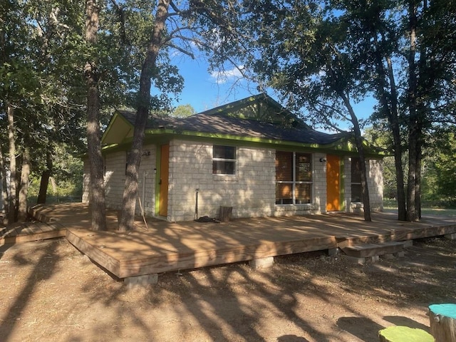 309 Stolle Ln, Flatonia, TX 78941 - view of side of property with a wooden deck and concrete block siding