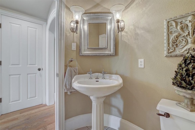 303 Rio Bravo Rd, Georgetown, TX 78628 - half bath featuring toilet and wood finished floors