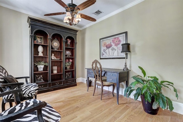 303 Rio Bravo Rd, Georgetown, TX 78628 - office featuring light wood-style floors, a ceiling fan, crown molding, and baseboards