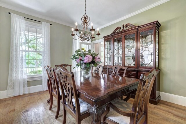 303 Rio Bravo Rd, Georgetown, TX 78628 - dining space featuring a chandelier, baseboards, light wood finished floors, and crown molding