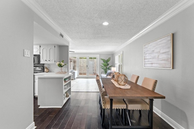 6109 Bullard Dr Unit A, Austin, TX 78757 - dining space with a textured ceiling, french doors, ornamental molding, and dark wood-style flooring