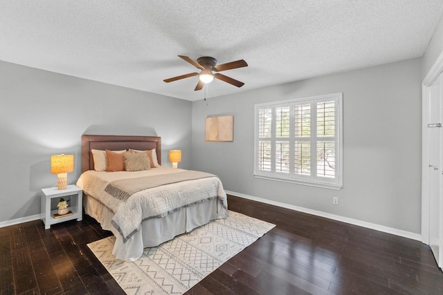 6109 Bullard Dr Unit A, Austin, TX 78757 - bedroom with wood-type flooring, a textured ceiling, and a ceiling fan