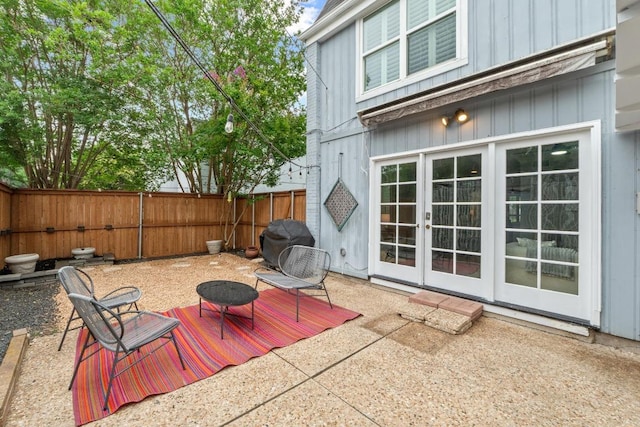 6109 Bullard Dr Unit A, Austin, TX 78757 - fenced backyard featuring french doors, area for grilling, a wooden deck, and a patio area