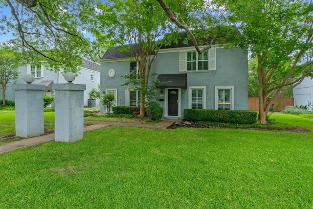 6109 Bullard Dr Unit A, Austin, TX 78757 - view of front facade with a front yard and brick siding
