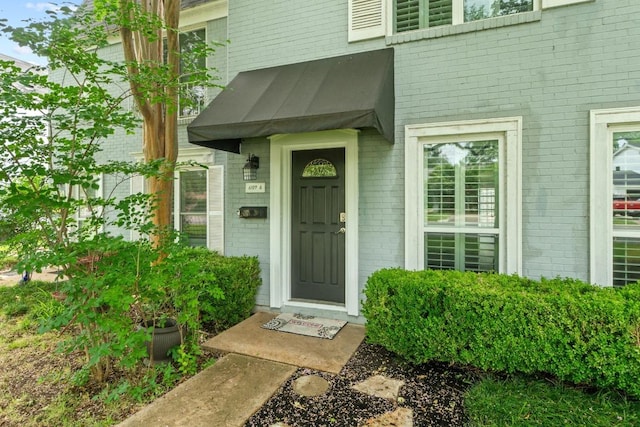6109 Bullard Dr Unit A, Austin, TX 78757 - doorway to property with brick siding