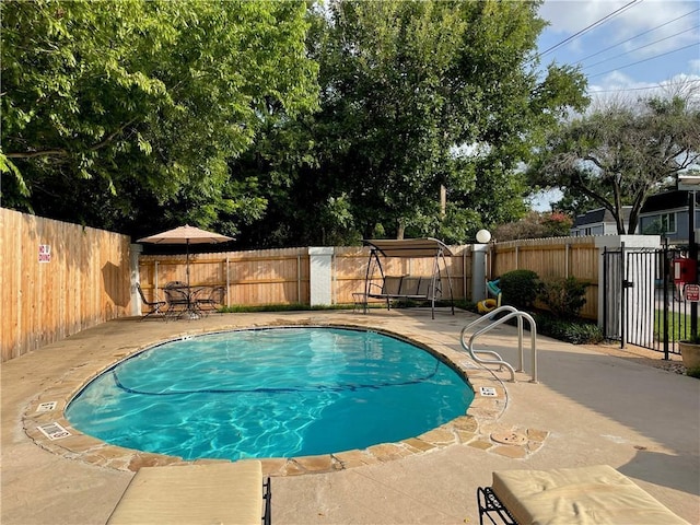6109 Bullard Dr Unit A, Austin, TX 78757 - view of swimming pool featuring a fenced backyard and a patio