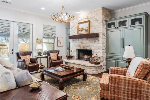 9122 Balcones Club Dr Unit 9, Austin, TX 78750 - living area with crown molding, a chandelier, a fireplace, and wood finished floors
