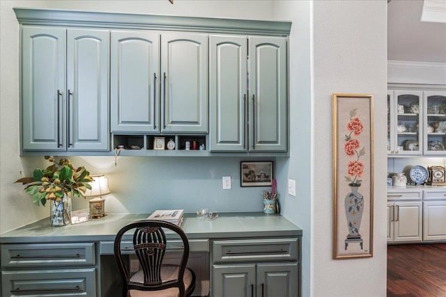 9122 Balcones Club Dr Unit 9, Austin, TX 78750 - office with built in desk, dark wood-type flooring, and ornamental molding