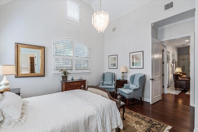 9122 Balcones Club Dr Unit 9, Austin, TX 78750 - bedroom with crown molding, a chandelier, dark wood finished floors, and a towering ceiling
