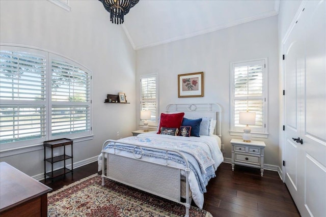 9122 Balcones Club Dr Unit 9, Austin, TX 78750 - bedroom featuring crown molding, lofted ceiling, hardwood / wood-style flooring, and baseboards