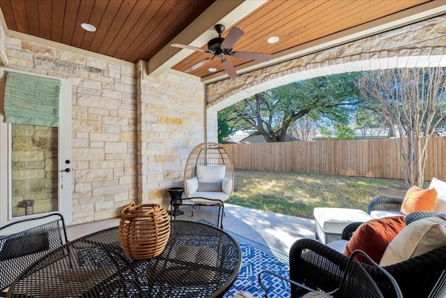 9122 Balcones Club Dr Unit 9, Austin, TX 78750 - fenced backyard with ceiling fan and outdoor dining area