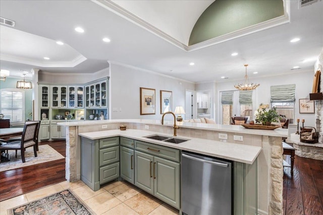 9122 Balcones Club Dr Unit 9, Austin, TX 78750 - kitchen with dishwasher, a sink, a chandelier, a center island with sink, and light countertops