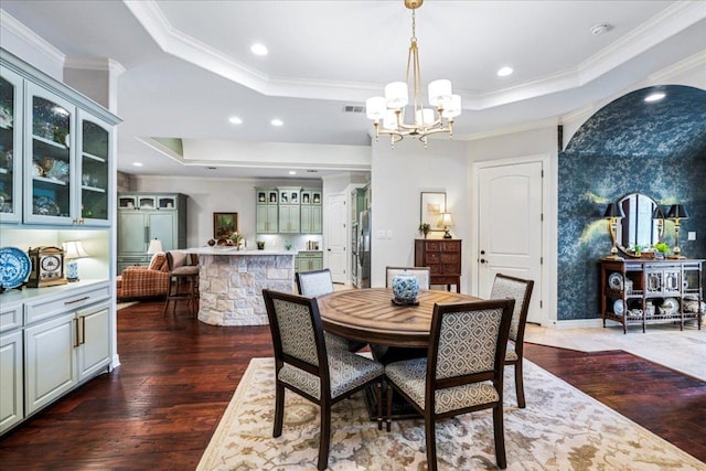 9122 Balcones Club Dr Unit 9, Austin, TX 78750 - dining space with a raised ceiling, wood-type flooring, a chandelier, crown molding, and recessed lighting