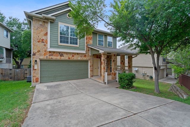 2009 Campfield Pkwy, Austin, TX 78745 - view of front facade with stone siding, a garage, driveway, central AC, and covered porch