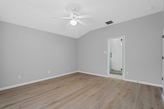 2009 Campfield Pkwy, Austin, TX 78745 - spare room with lofted ceiling, ceiling fan, light wood-style floors, and baseboards
